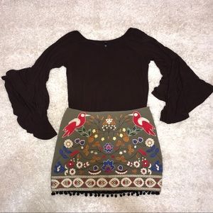 Green skirt with tassels